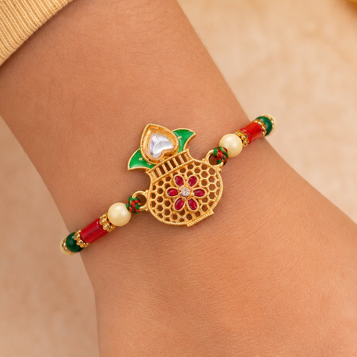 Classic Rakhi featuring Kalash Charm and red stone accents in chain look for Gift Use