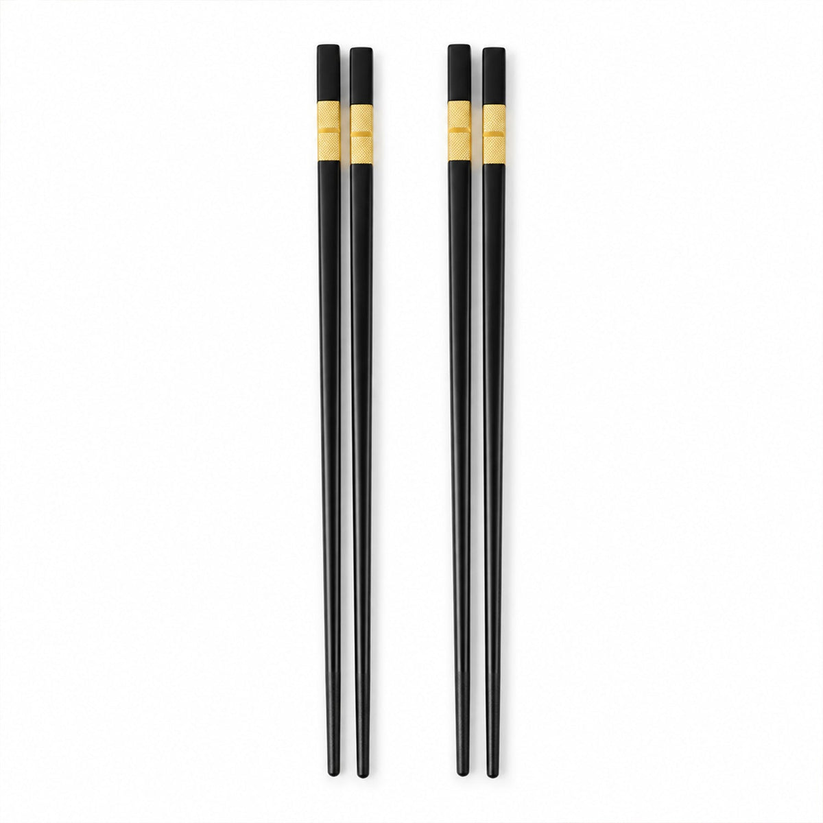 Two pairs of sleek black chopsticks with golden accents are arranged vertically on a plain white background.
