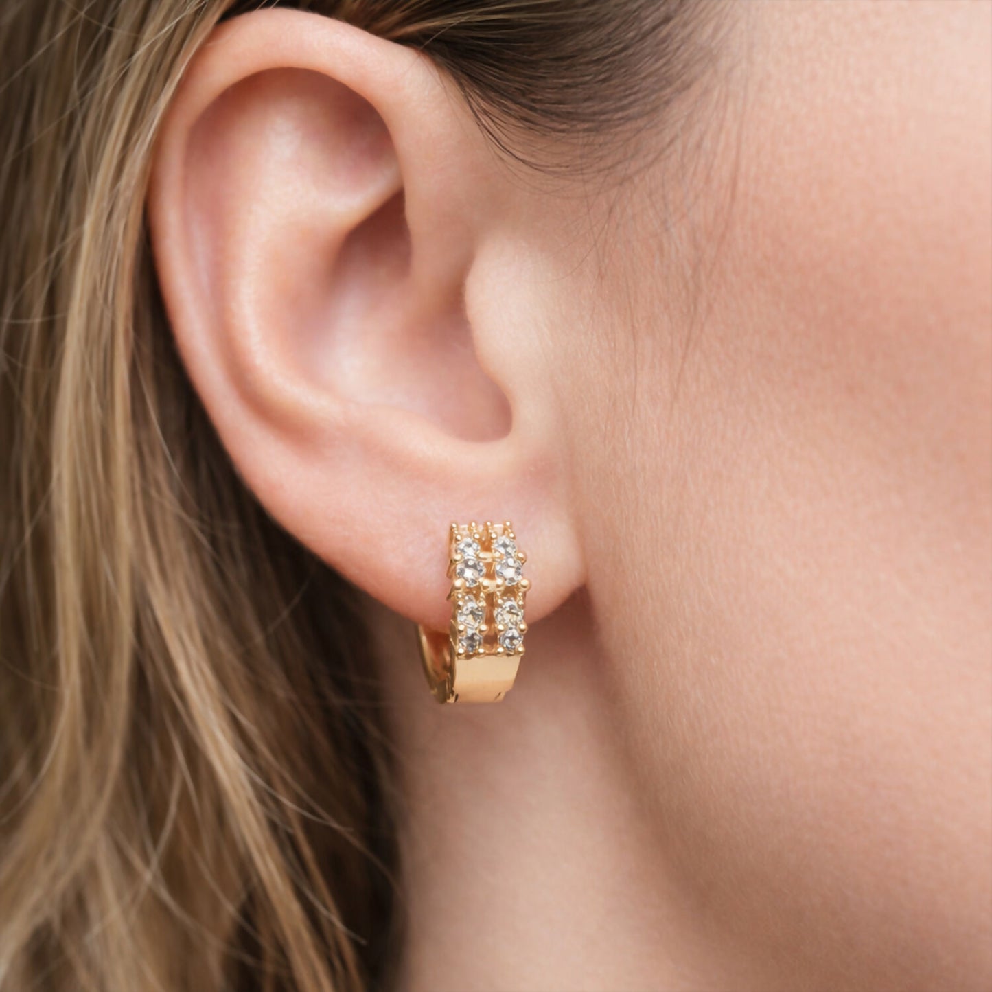 Gold-tone crystal studded hoop earrings showcasing sparkling detail