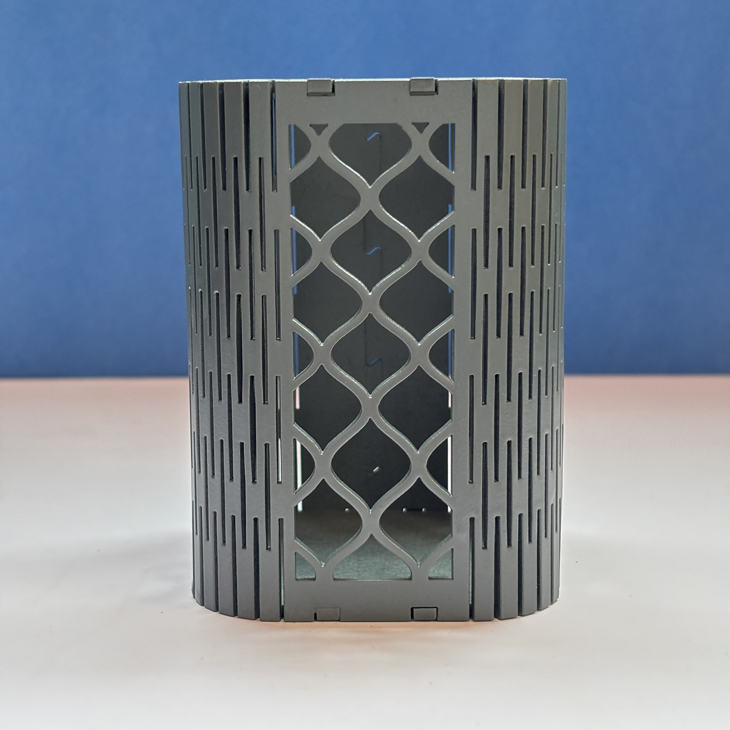 Geometric mesh pen holder enhancing a contemporary office workstation.