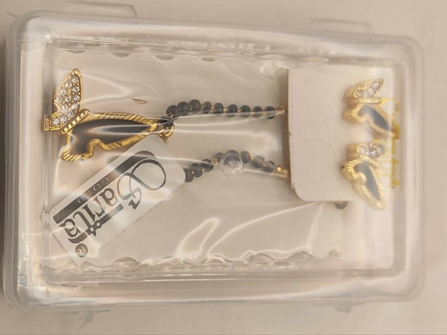 Complete gold-plated butterfly mangalsutra set displayed on a fabric background