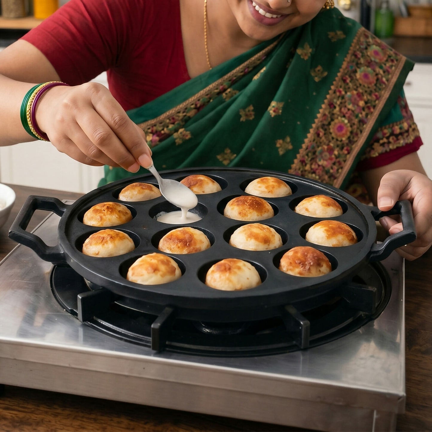 Side view of cast iron appam patra pan with handles