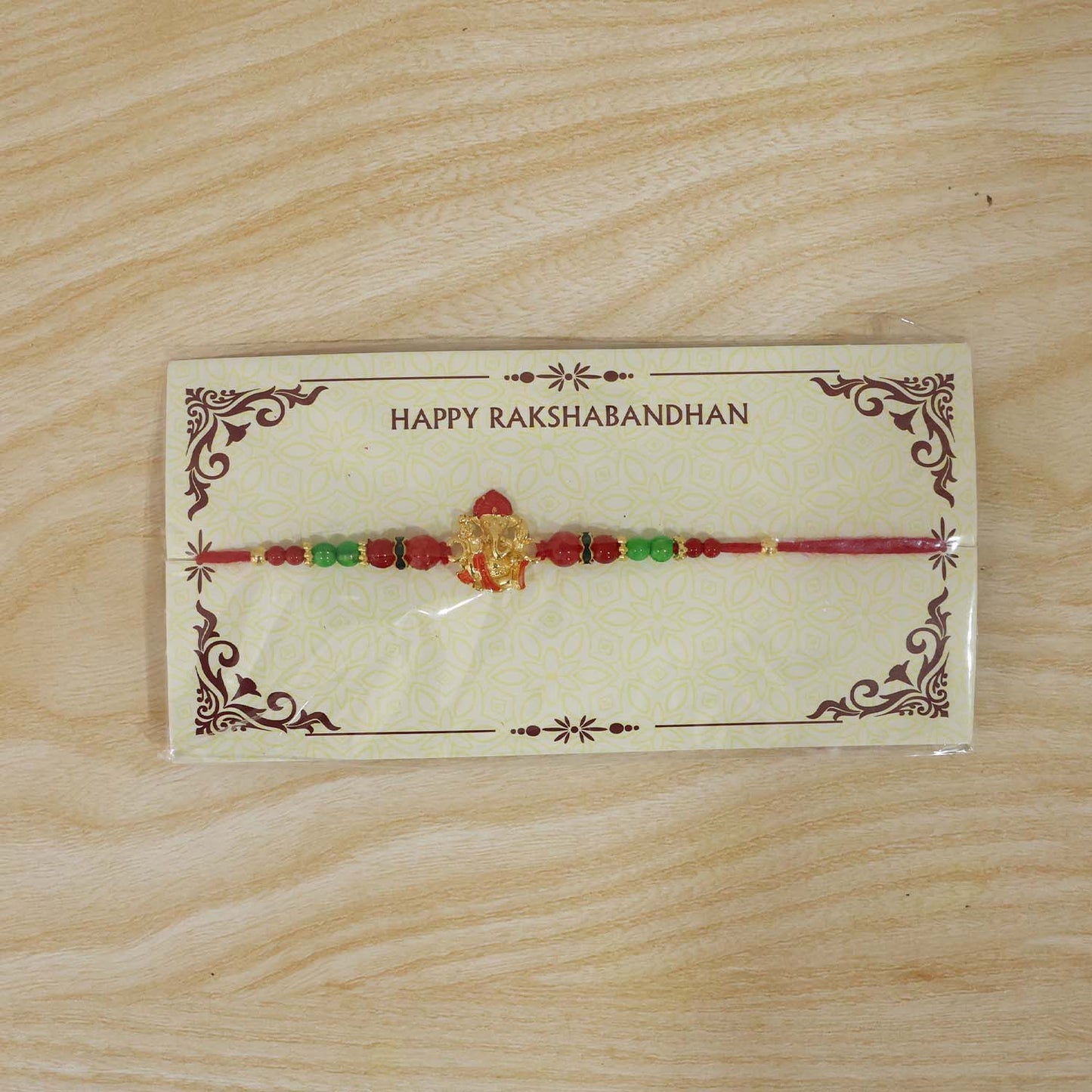 Antique golden Rakhi with designer elements and beads