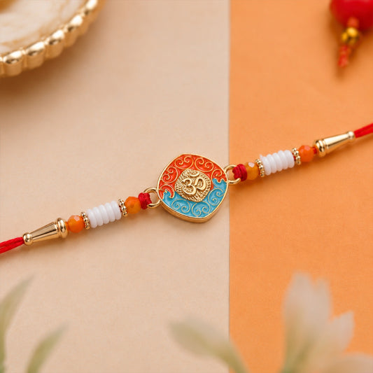 OM Symbol Rakhi with intricate design and soft thread for Raksha Bandhan.