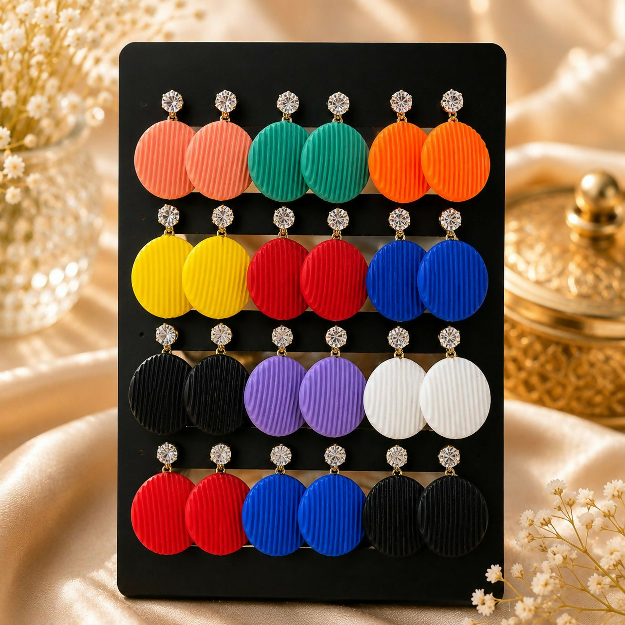 A woman models a vibrant set of colorful drop earrings, showcasing a variety of styles for different occasions.