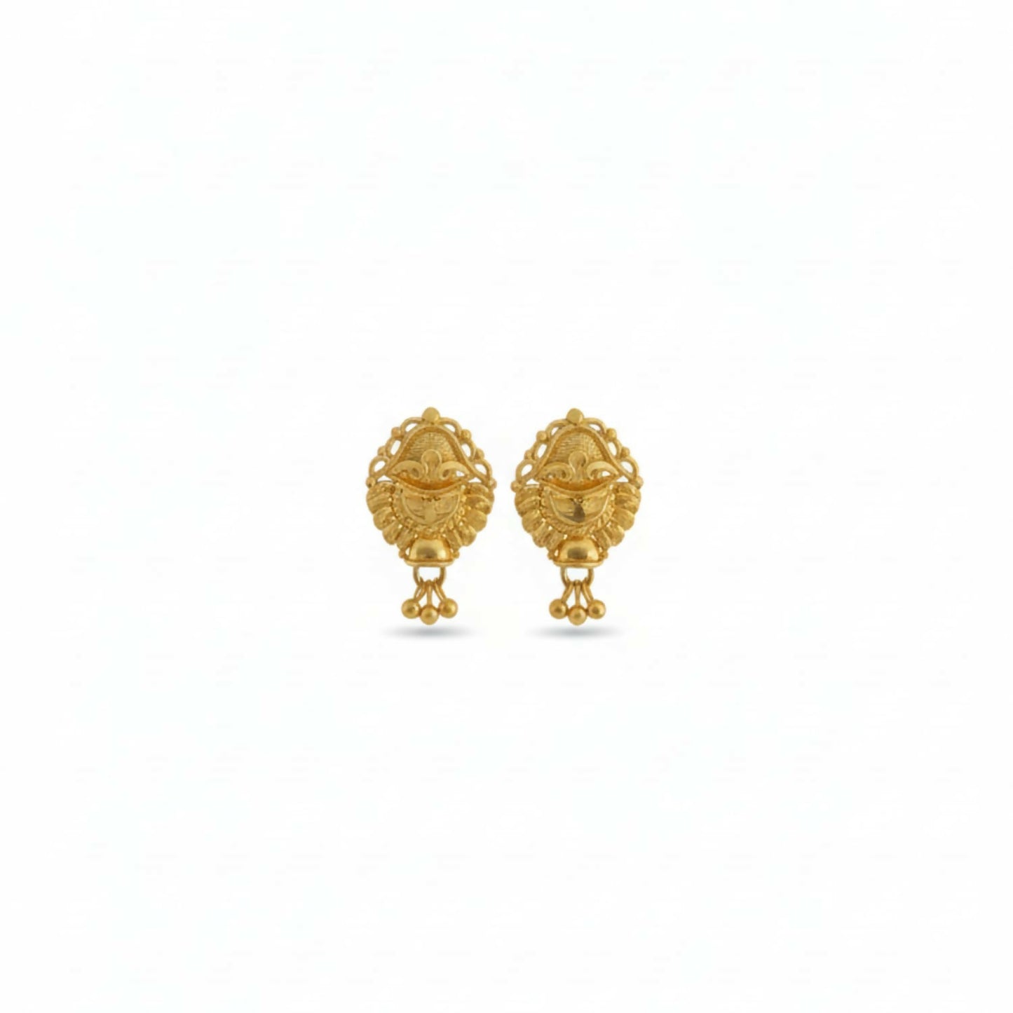 Golden jhumka earrings styled with Indian ethnic outfit for women and girls