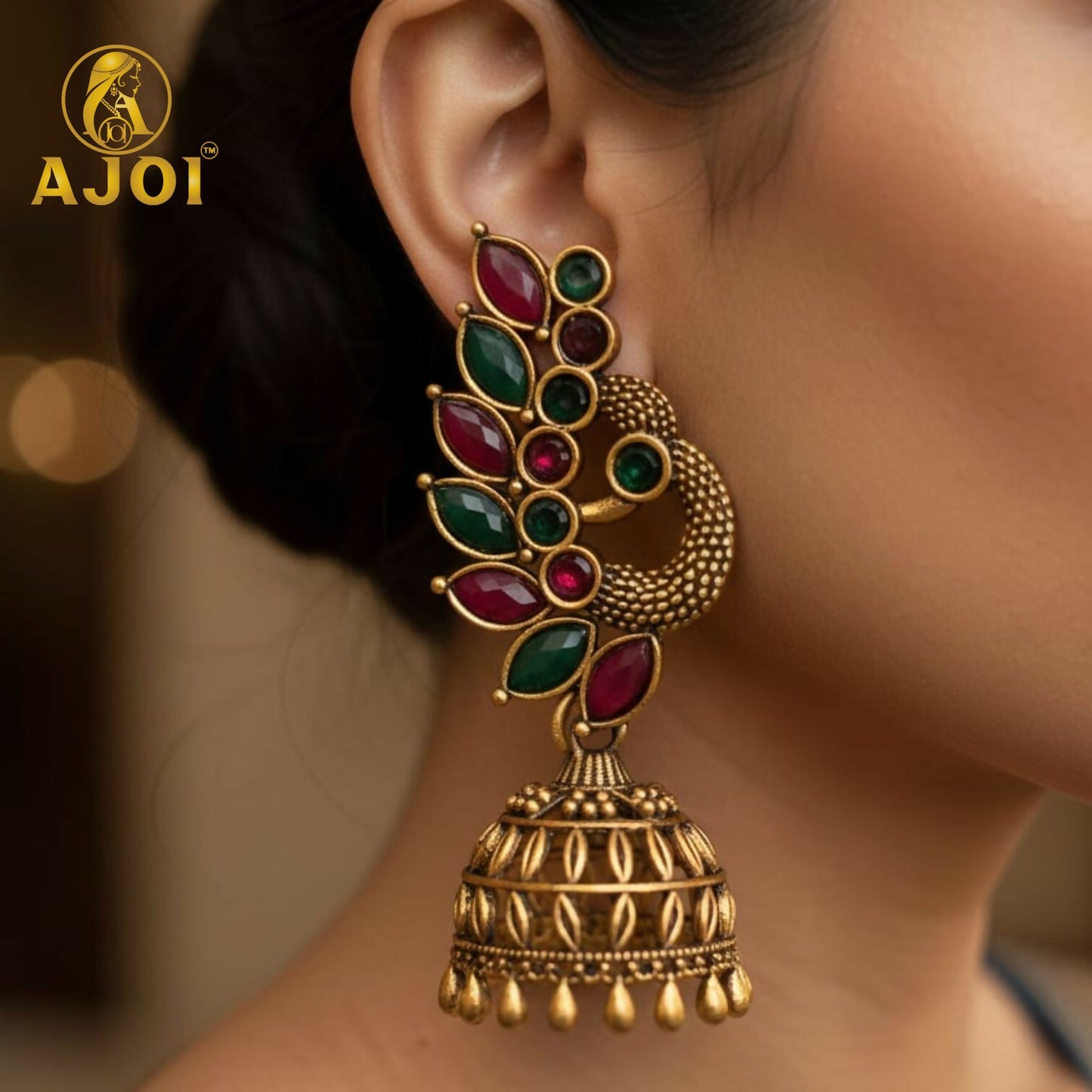 Close-up view of peacock and floral detailed oxidized silver and antique gold earrings combo