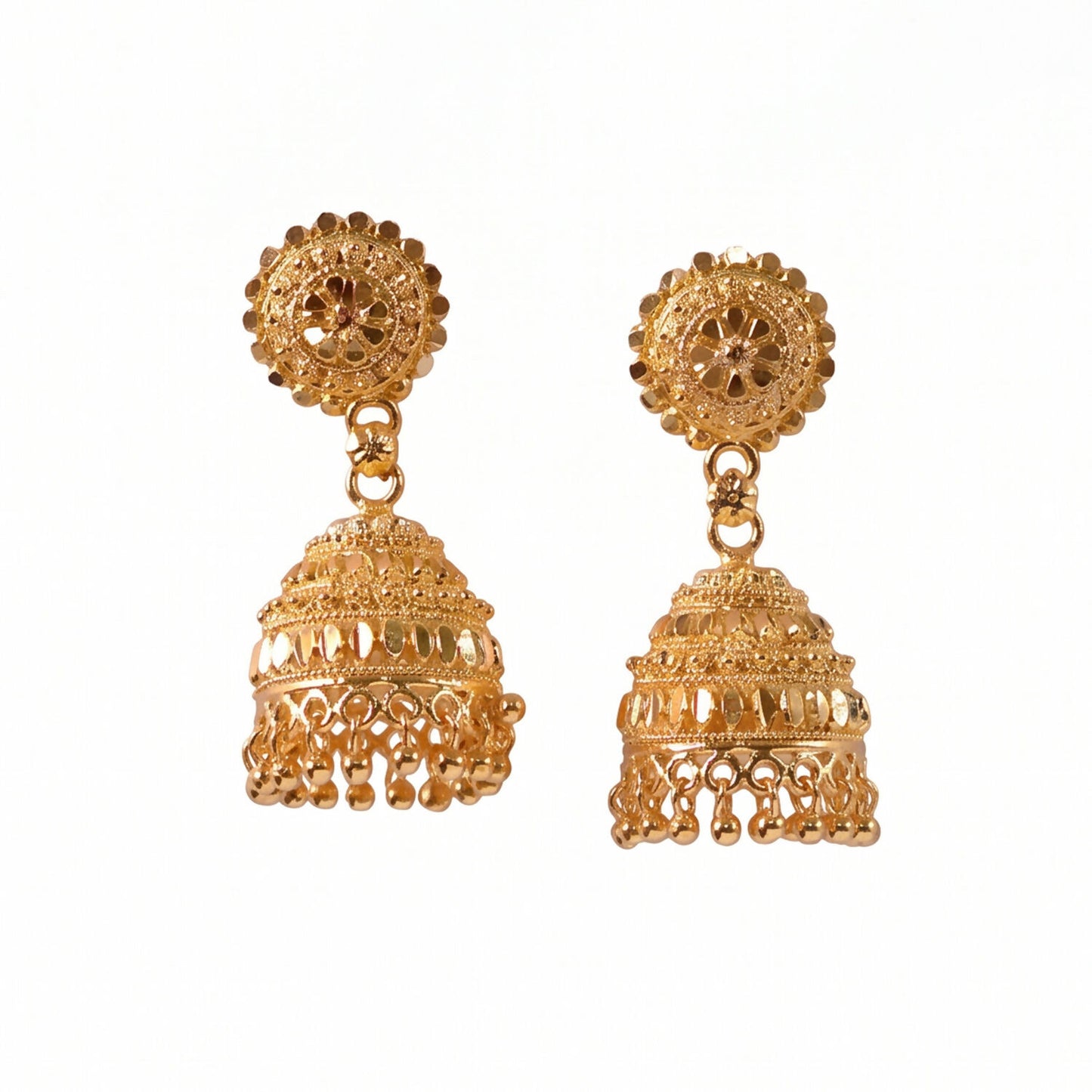 Front angle of gold jhumka earrings with pearl accents