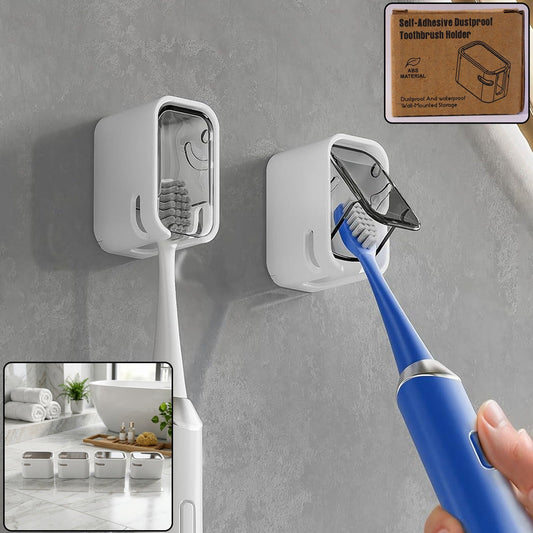Two white wall-mounted toothbrush holders with clear covers on a gray bathroom wall, one holding a white toothbrush, the