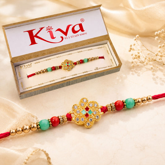 Silver clover meenakari rakhi for brother with turquoise beads and American Diamonds.