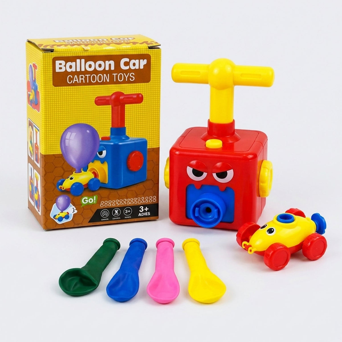 A red pump, yellow car, and four deflated balloons are arranged next to a product package.