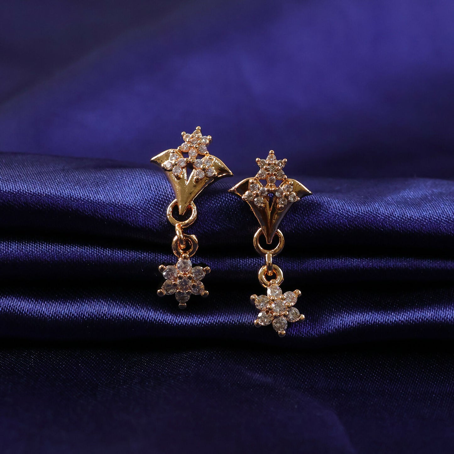 Delicate floral celestial star drop earrings in warm rose gold tone