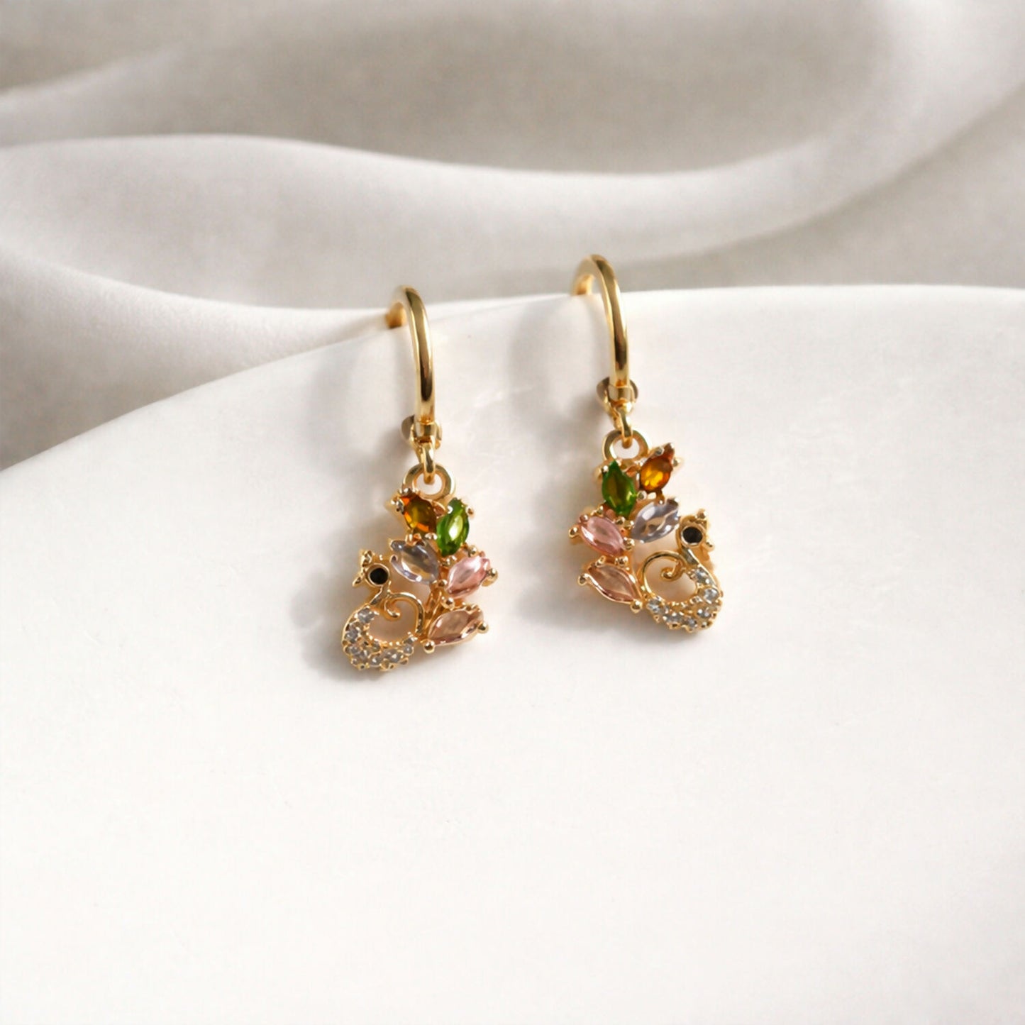 Side view of lightweight multicolor gemstone drop earrings with gold finish
