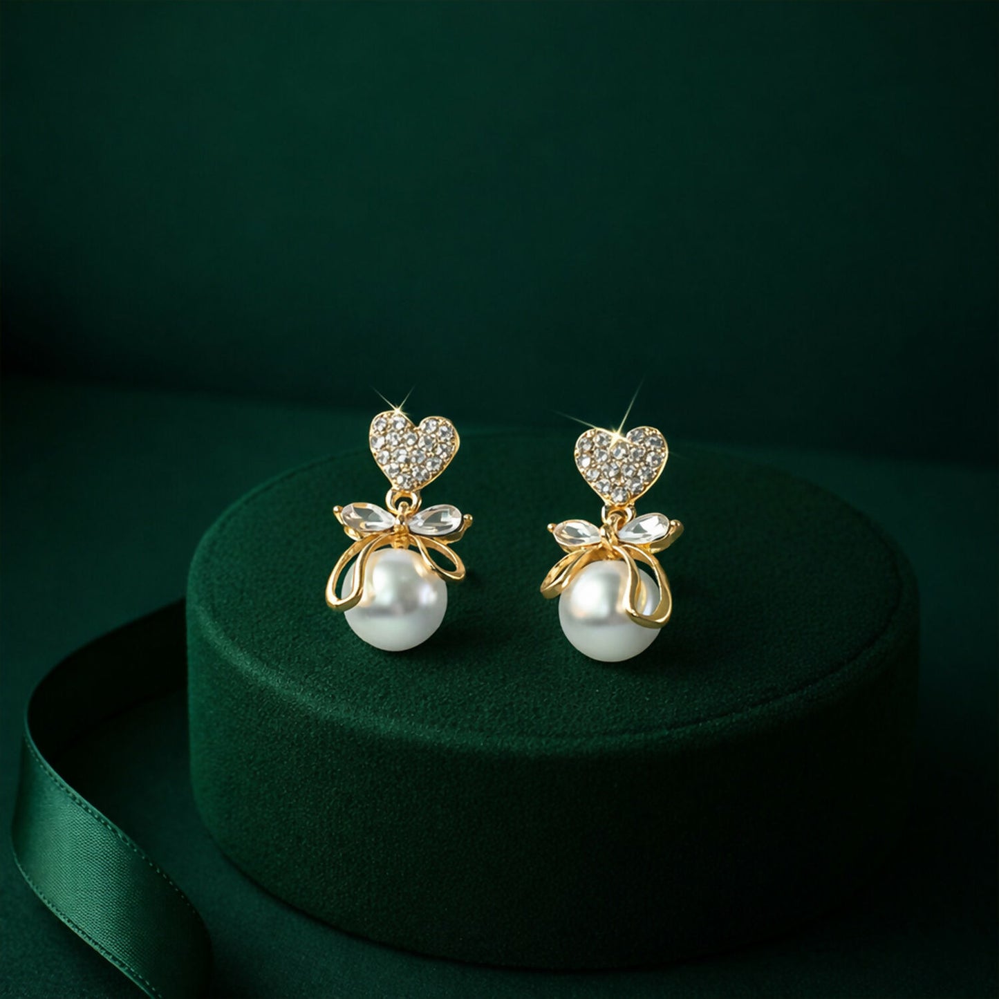 Romantic Heart Crystal and Pearl Bow Earrings on jewelry stand