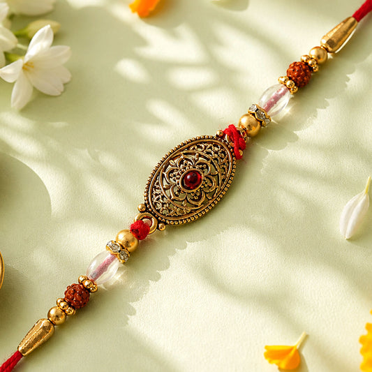Oxidized Gold Oval Pendant Rakhi with Red Stone and Rudraksha Beads