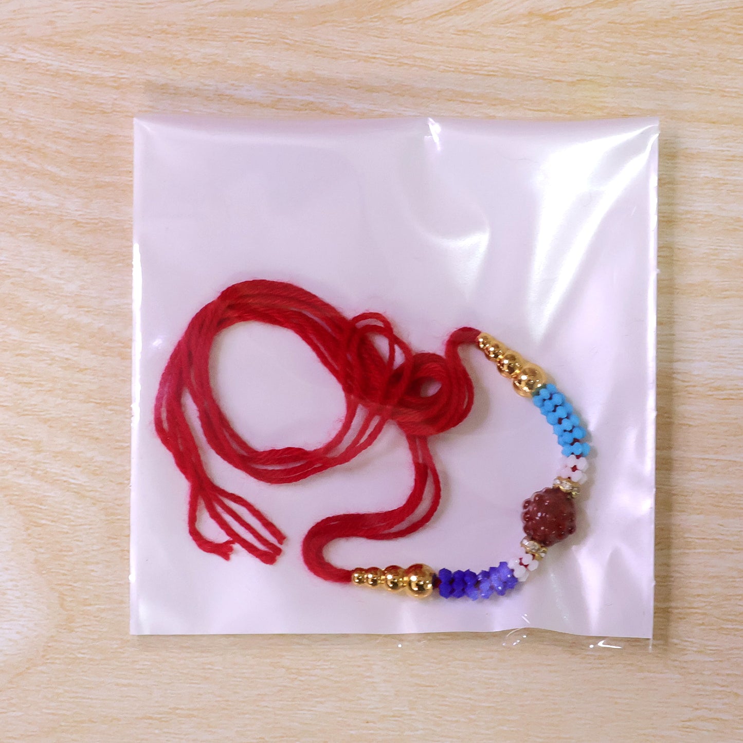 Blue Red Beaded Rakhi with Gold Accents and Classic Festive Brother Gift Appeal Ideas
