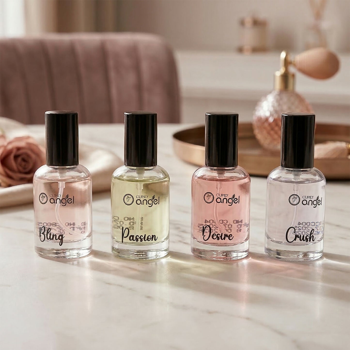 Four Cupid perfume miniatures on white background