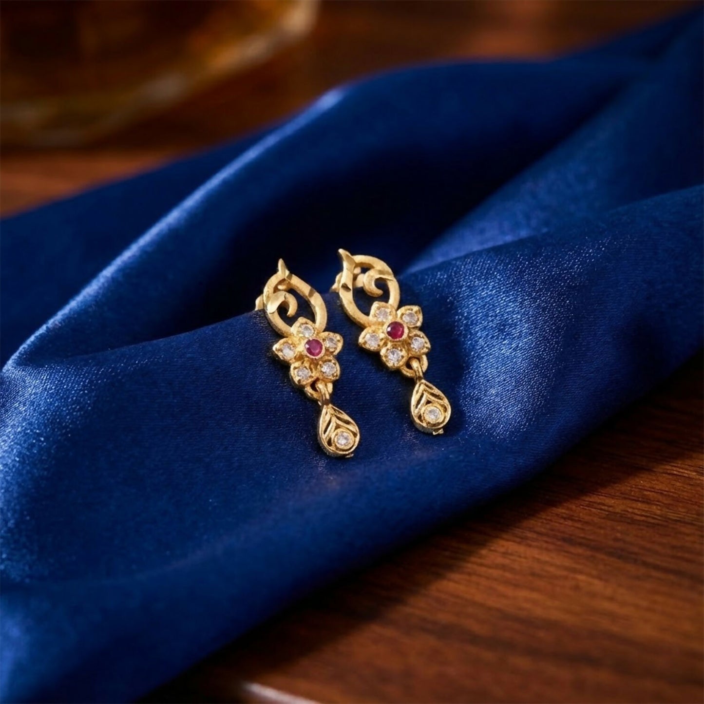 Traditional Floral Gold Earrings With Ruby Center Stone And Leaf Shaped Drop Detail