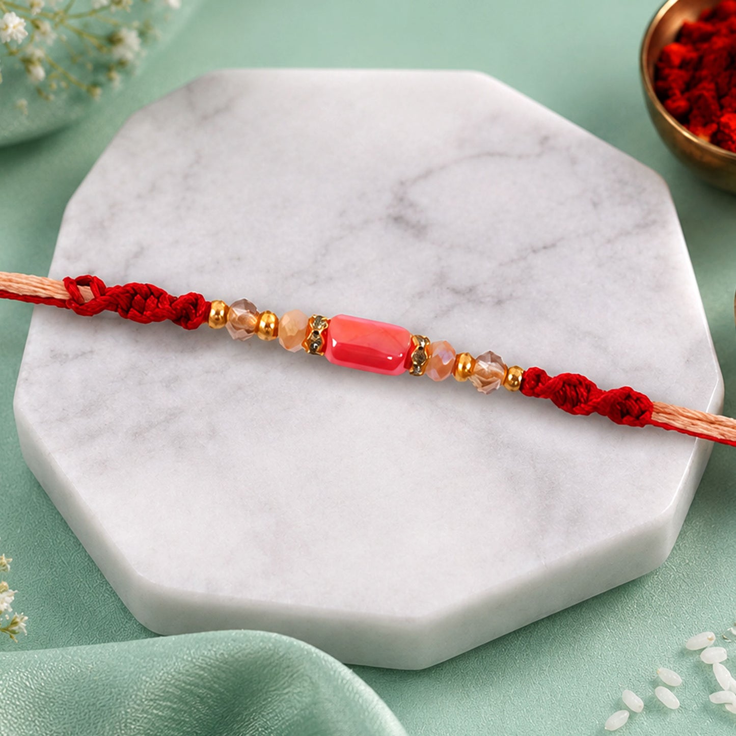 Sparkling Pearl Stone Rakhi with Colorful Thread and Premium Festive Beauty