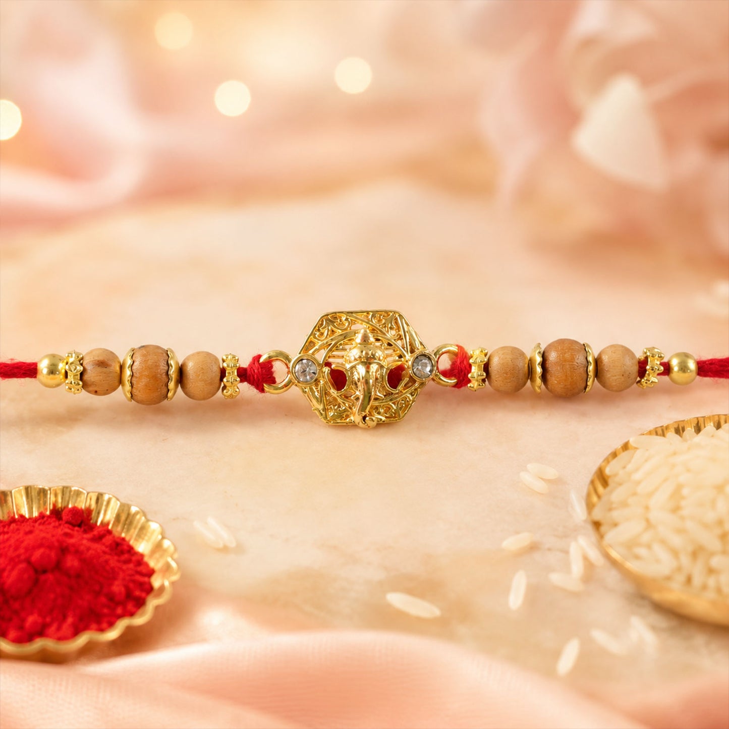 Ganesh Temple Devotional Rakhi with Golden Centre, Wooden Beads and Red Thread