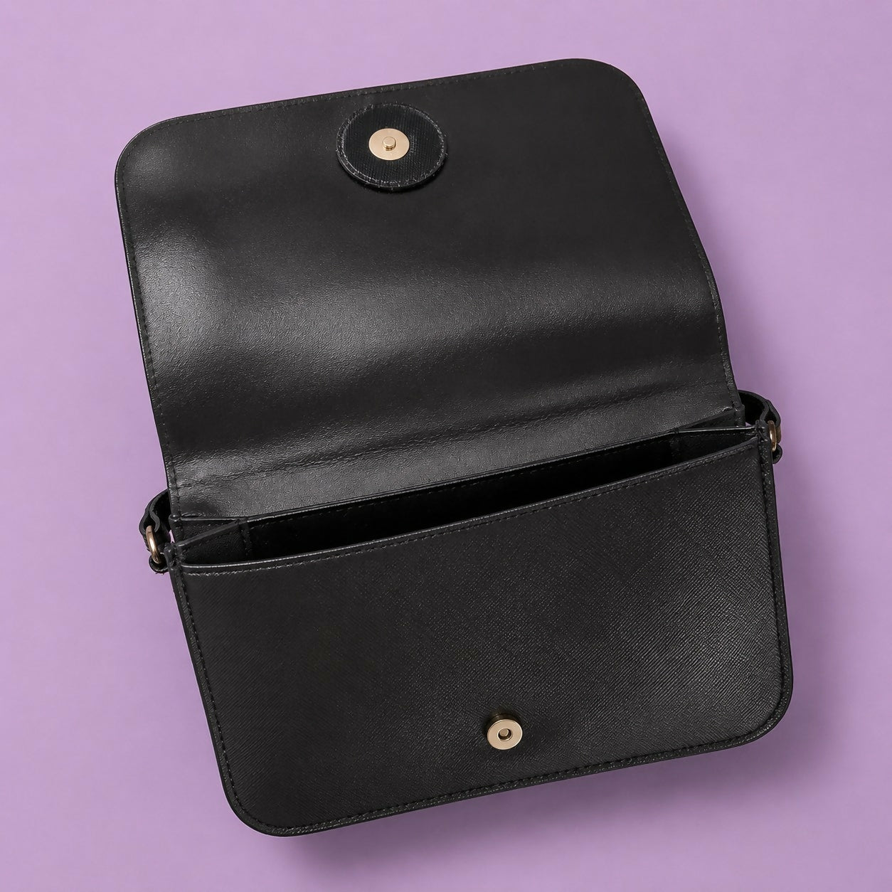 Open compartment of purple sling bag showing spacious interior