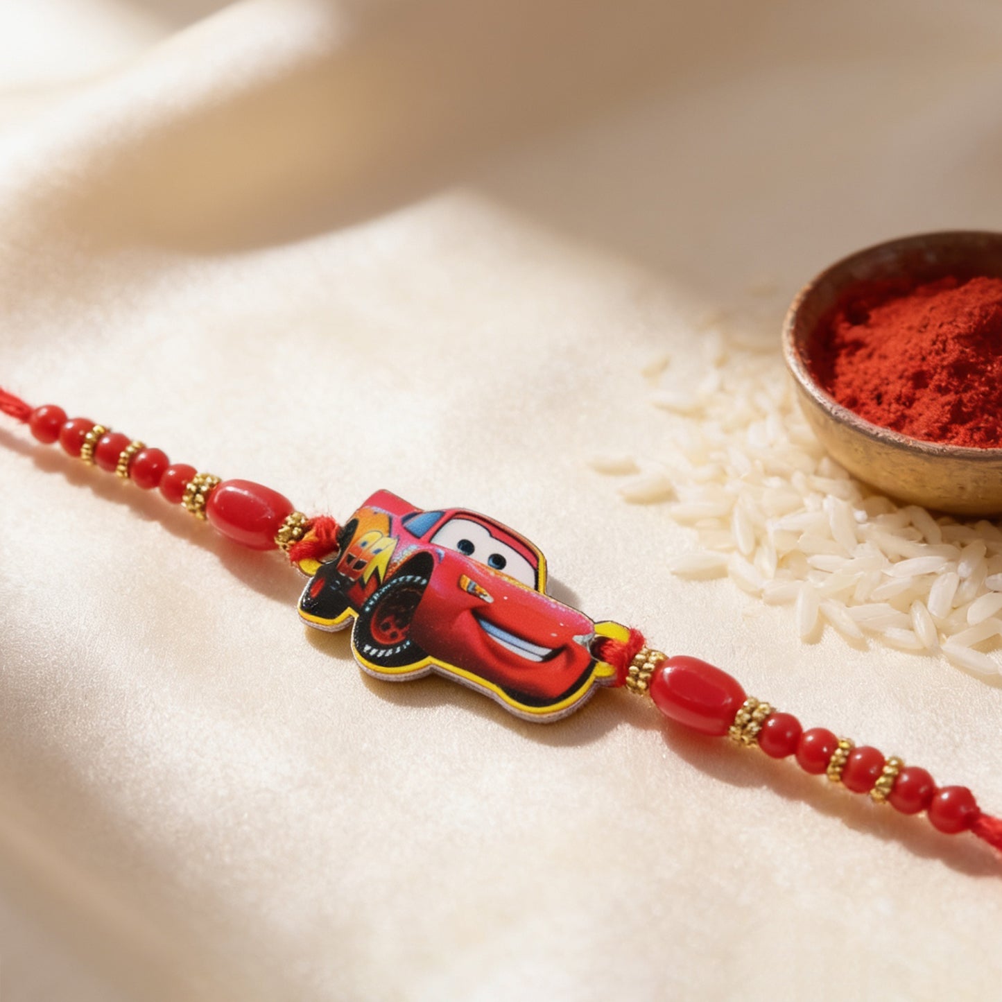 Red Racing Car Kids Rakhi with Gold Beads and Red Thread