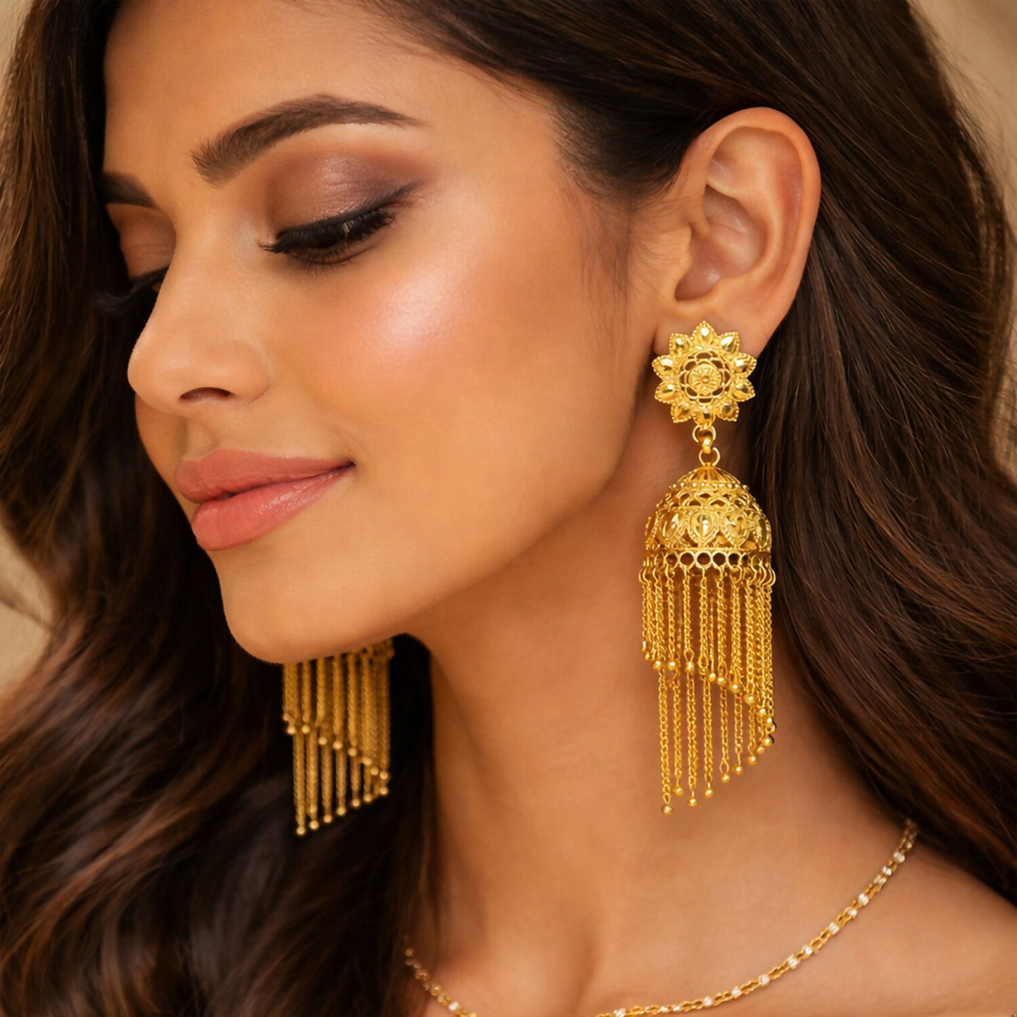Traditional Gold Tone Floral Jhumka Earrings with Long Chain Tassel Design