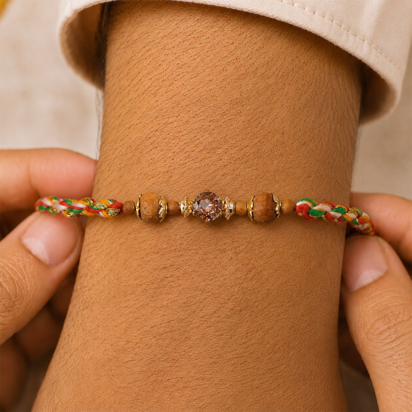 Vibrant Stone Rakhi with Color Beads, Gold Accents and Festive Thread Beauty