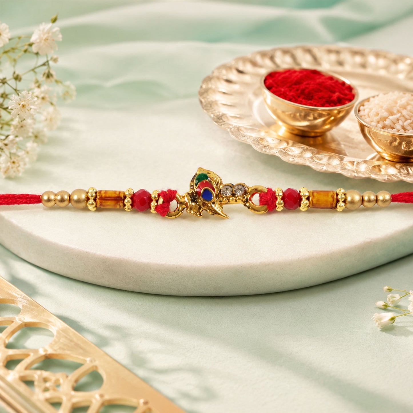 Peacock Floral Crescent Rakhi with Antique Gold Centre, Color Stones and Red Thread