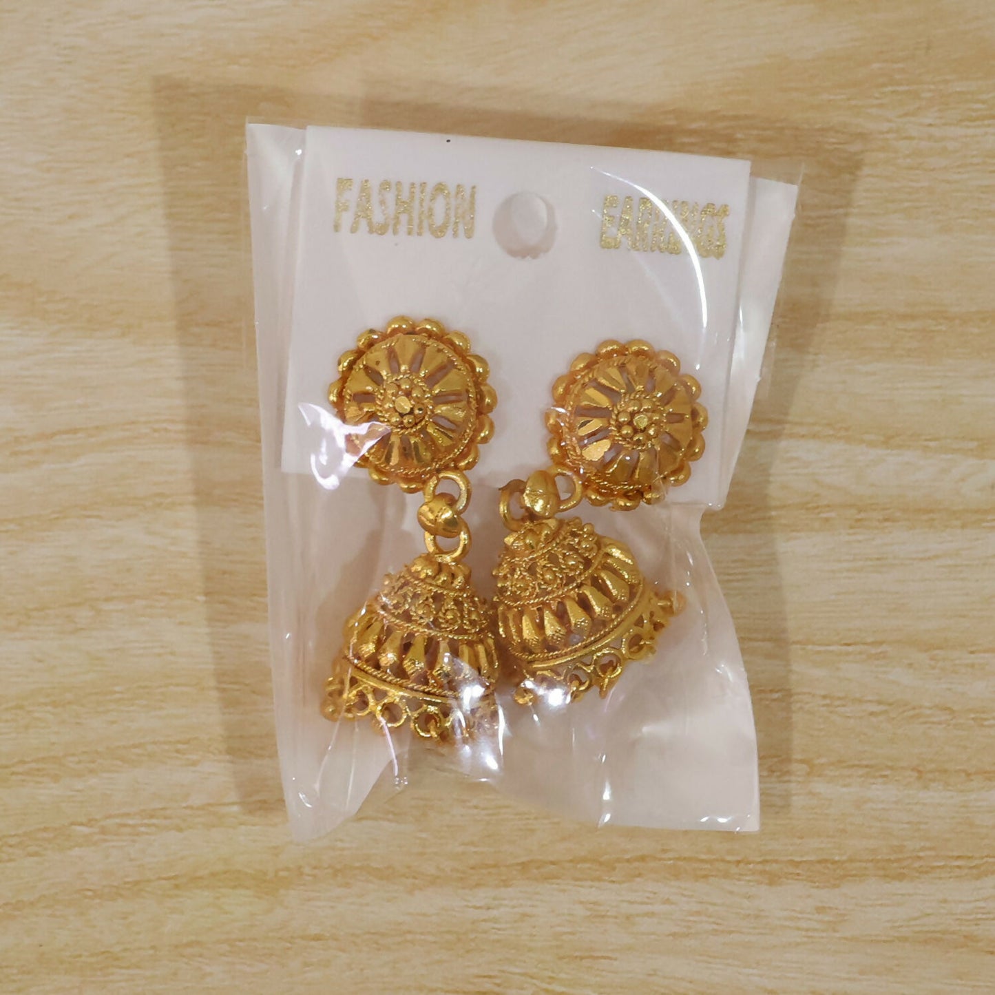 Elegant bridal gold jhumka earrings with pearls