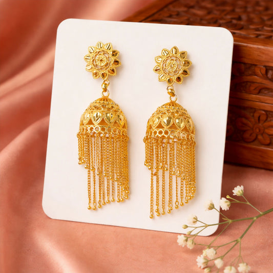Traditional gold tone floral jhumka earrings with long chain tassels front view
