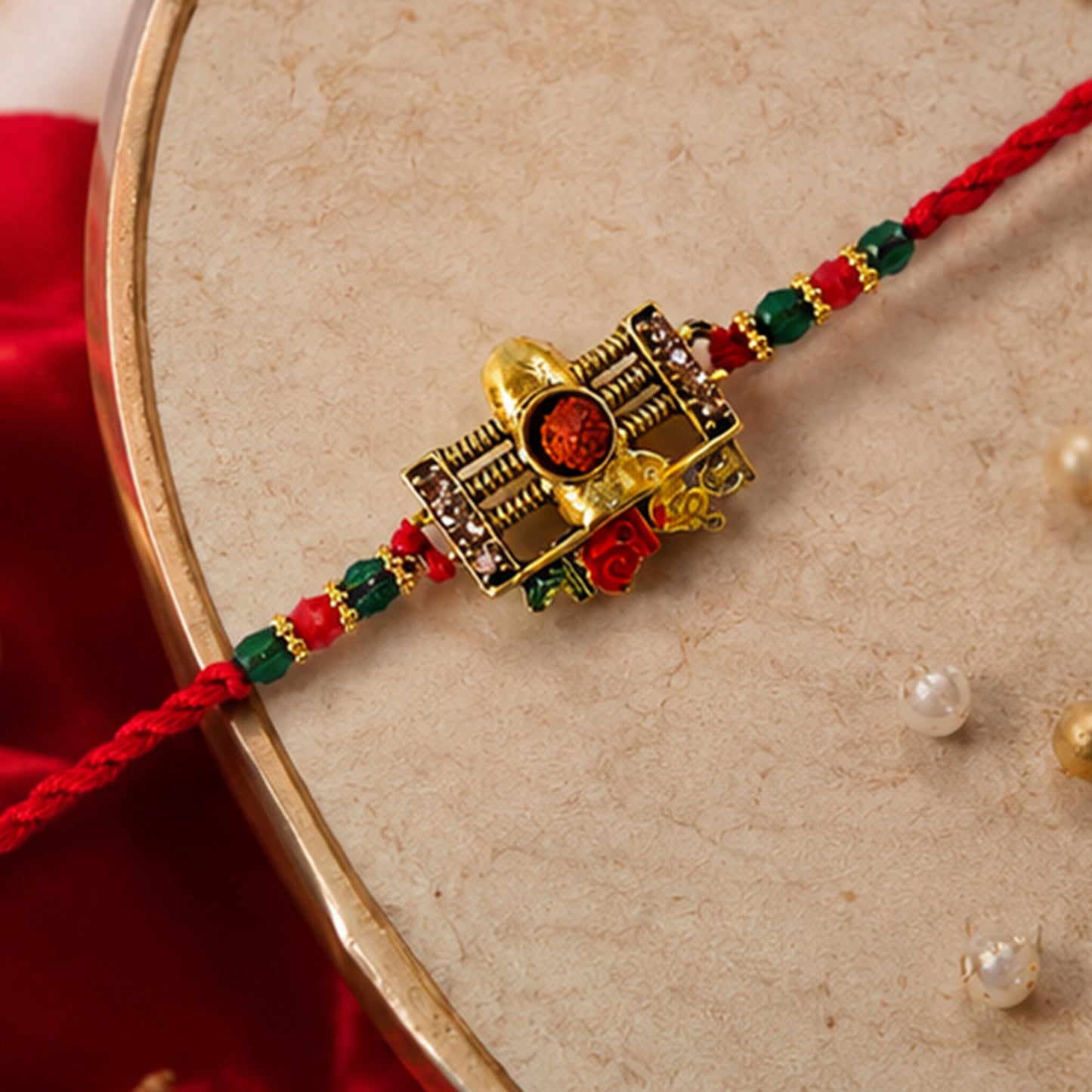 Traditional Shivling Rudraksha Rakhi with Red & Green Beads