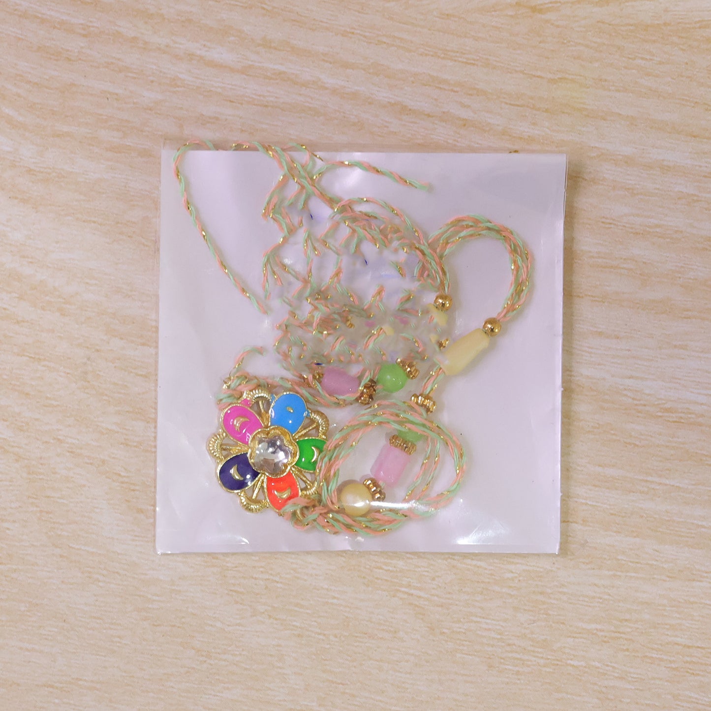 Multicolor Floral Kundan Pendant Rakhi with Pastel Beads