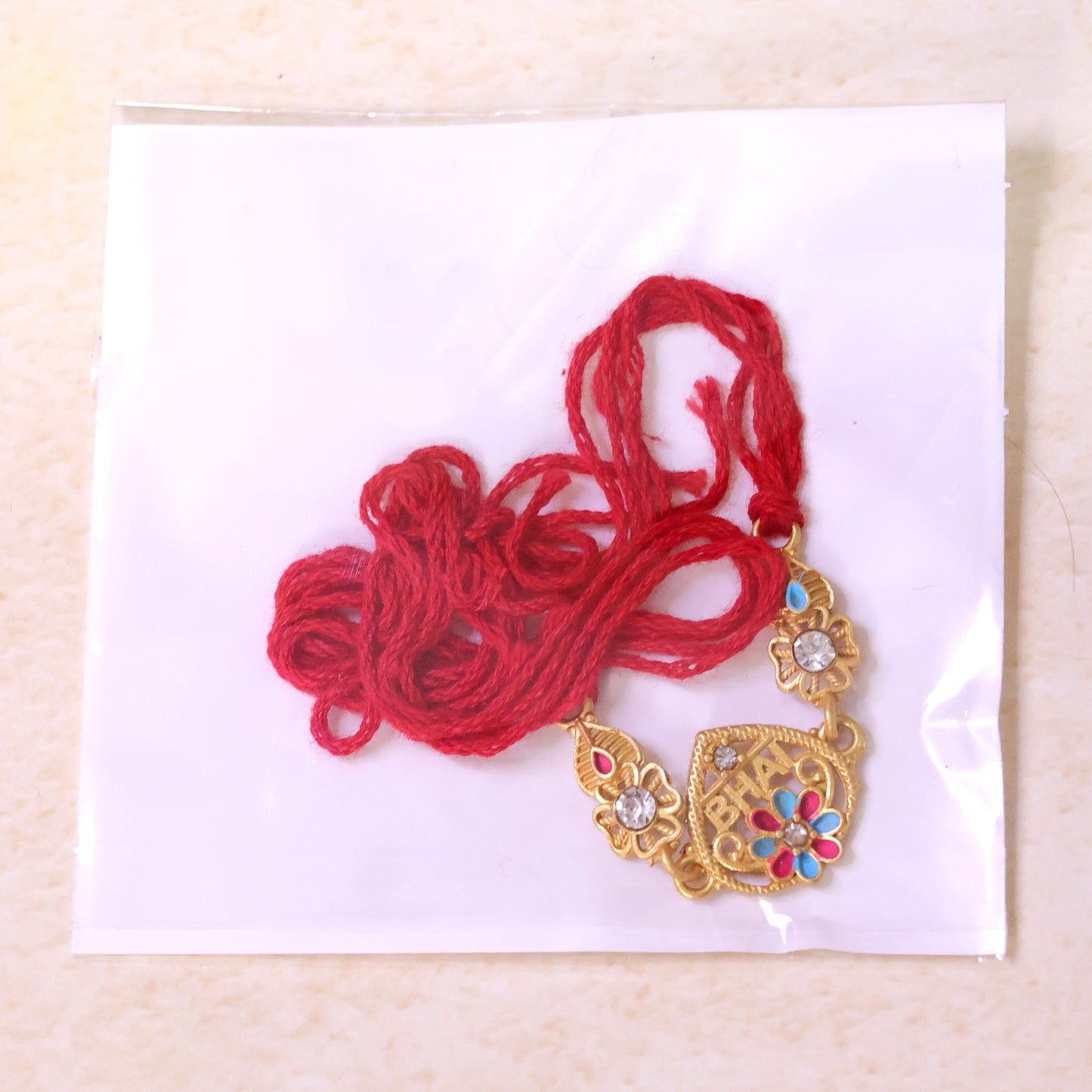 Designer Rakhi featuring BHAI Floral Plaque, clean frame and display look for Gifting