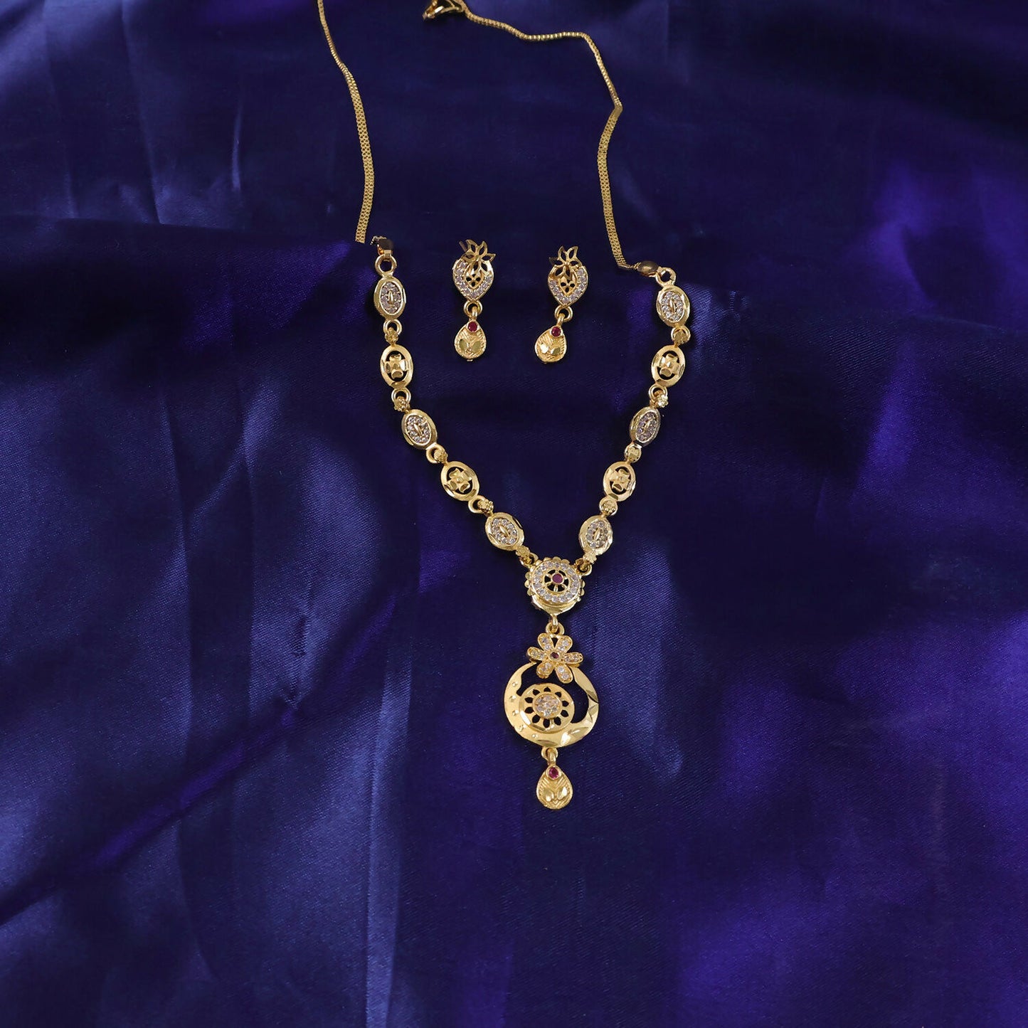 Stylish Gold-Tone Circular Pendant Necklace Set with Floral Accent & Matching Earrings