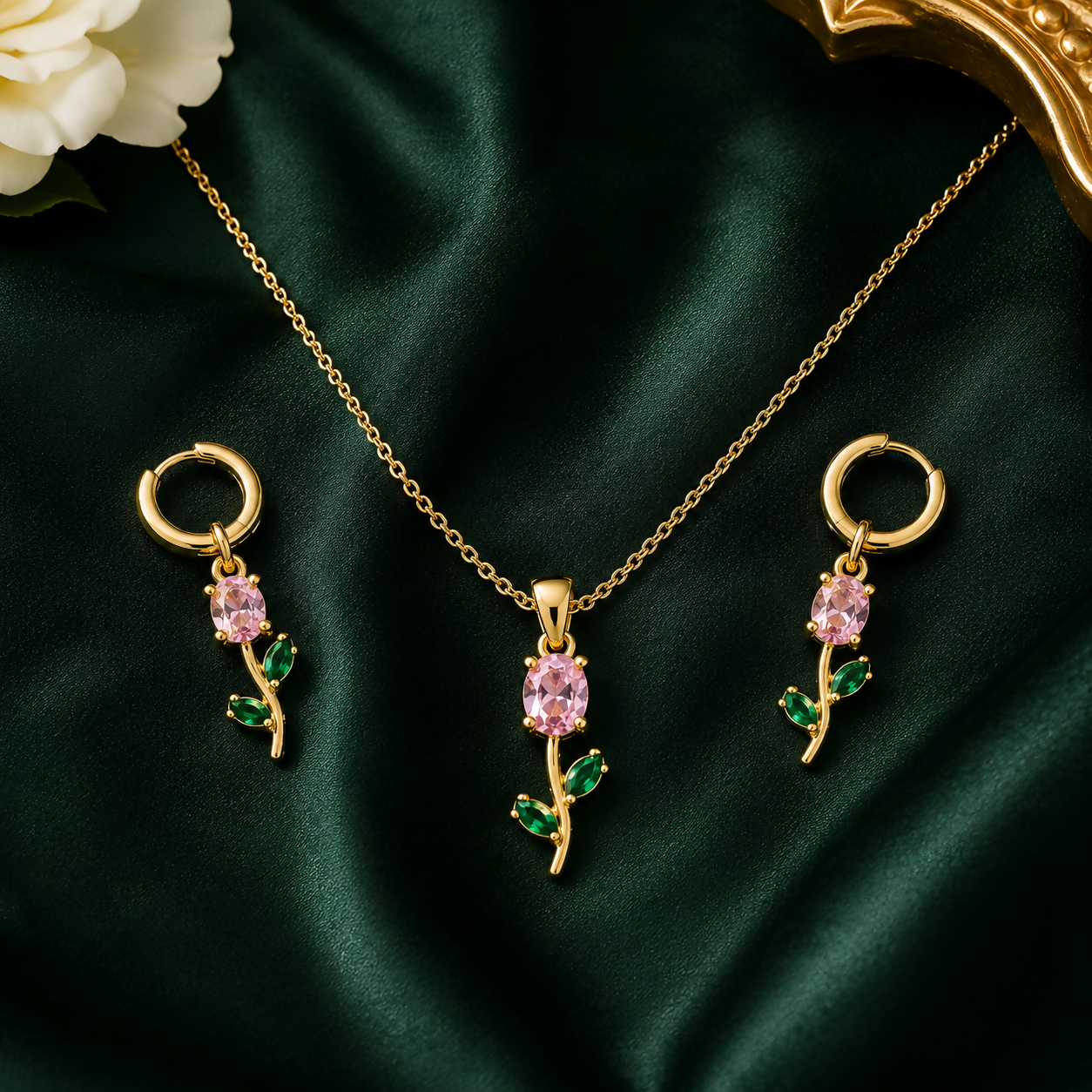 Pink crystal floral pendant necklace set with matching earrings displayed elegantly.