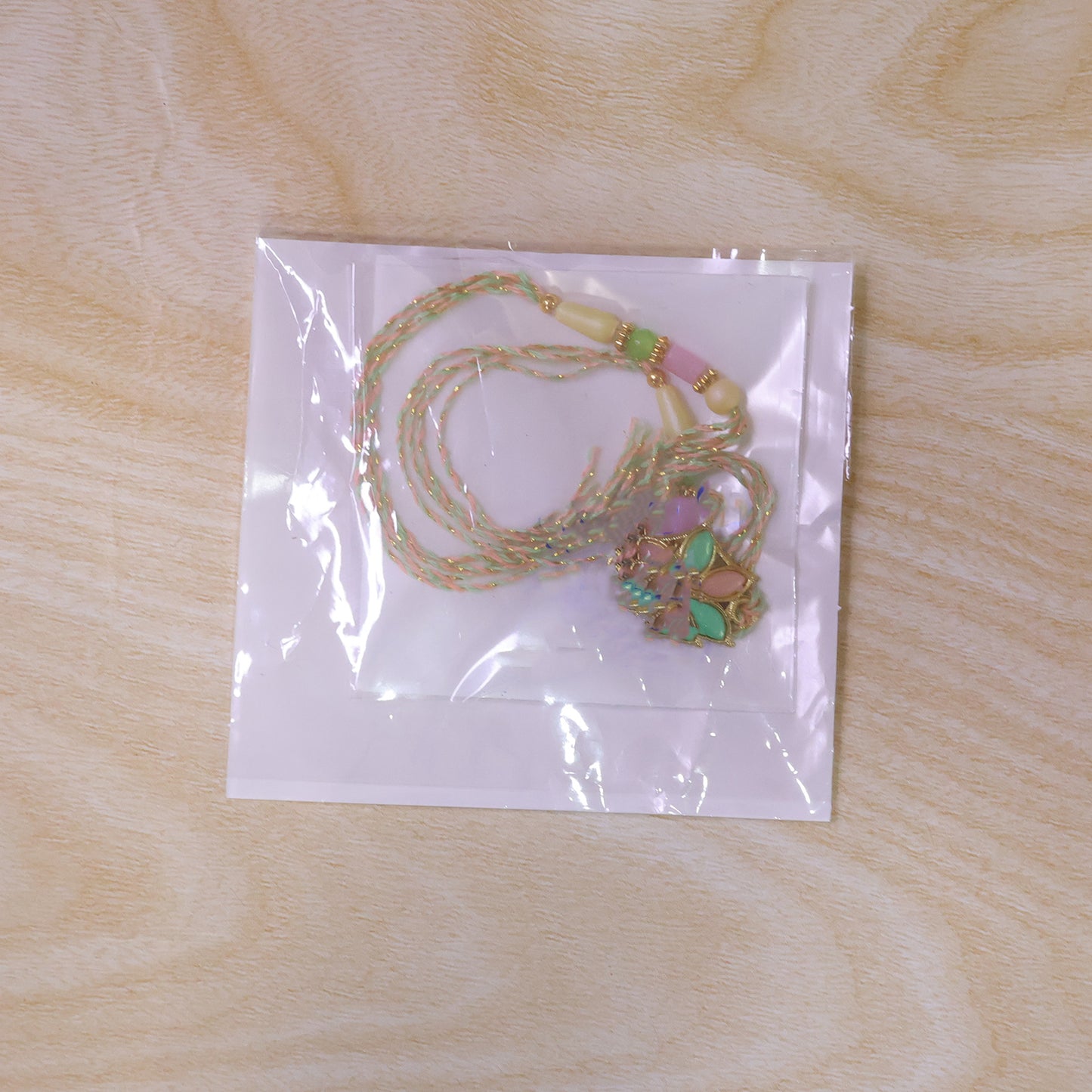 Multicolor Floral Enamel Pendant Rakhi with Pastel Beads