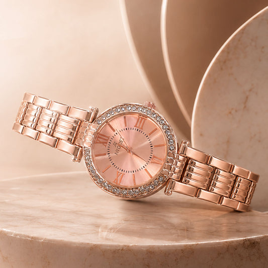 Women's rose gold watch with crystal bezel and Roman numeral dial, displayed elegantly.