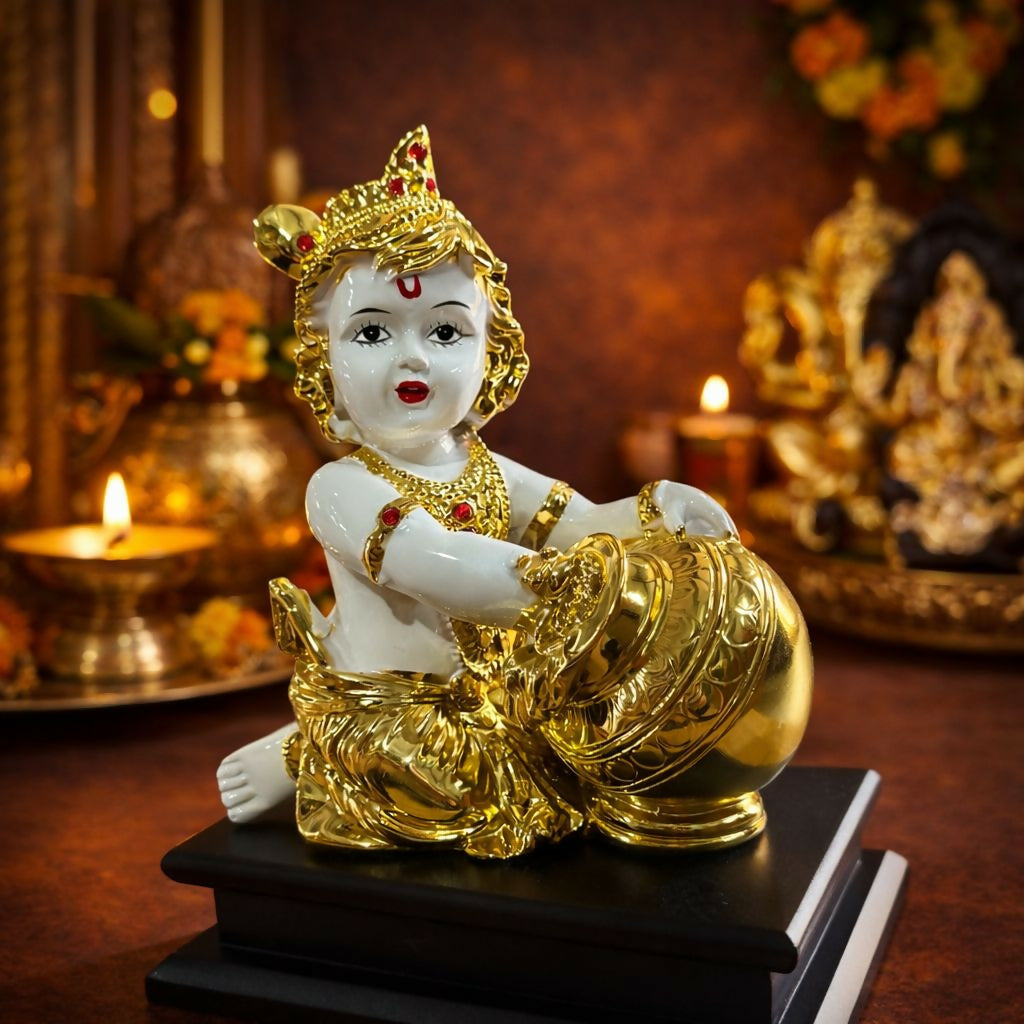 Bal Krishna idol with golden butter pot on decorative base