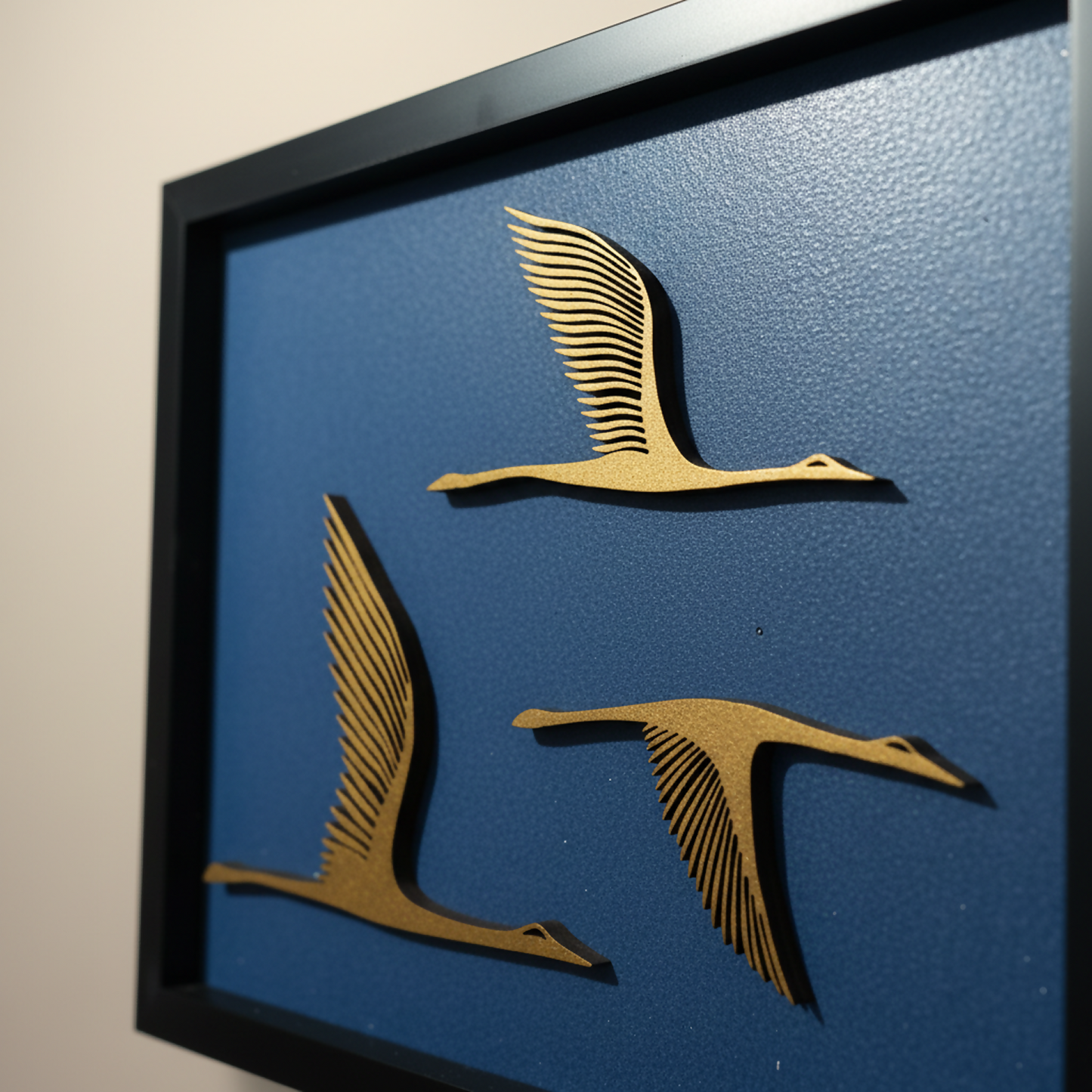 Close-up of laser-cut layered wooden flying bird wall decor