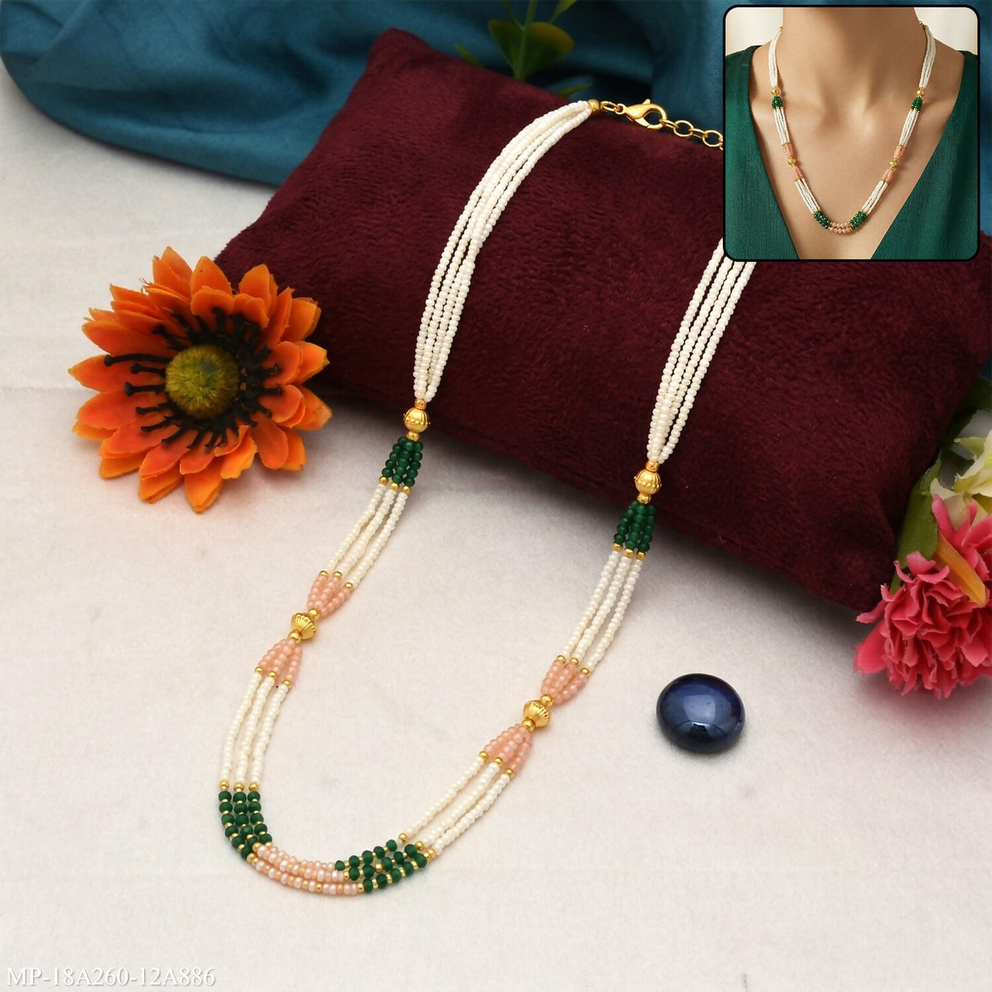 Traditional mala necklace with green and peach bead accents perfect for festive occasions