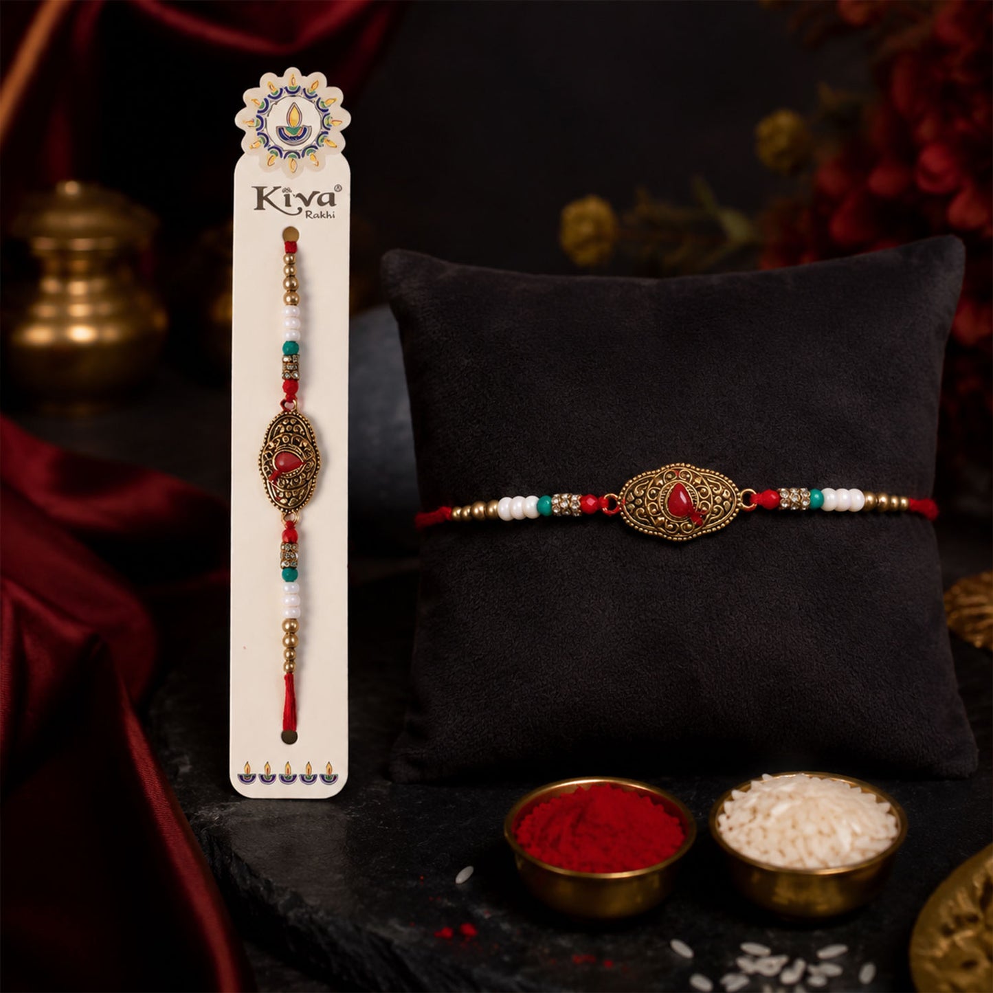 Antique Gold Teardrop Designer Rakhi with Red Stone, Roli Chawal Coin and Diya Gift Packing