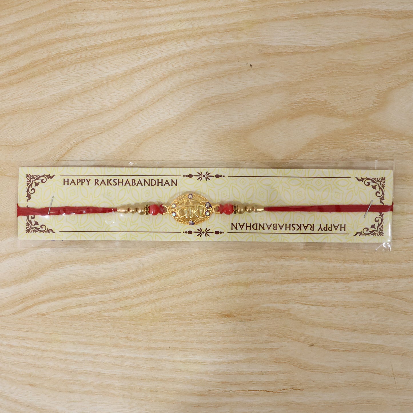 Golden Veera Rakhi for Boys with Red Beads and Thread