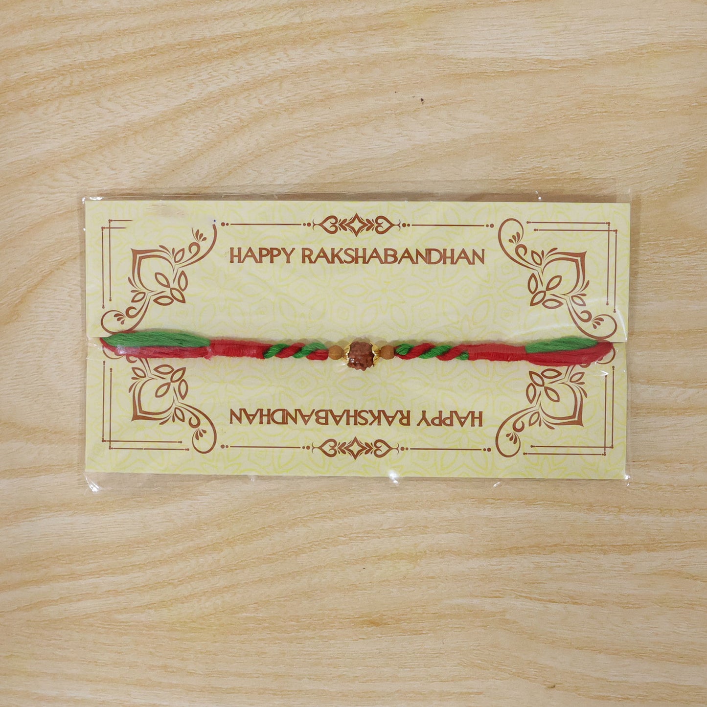 Green Red Designer Rakhi with Golden Bead Accents and Traditional Festive Beauty