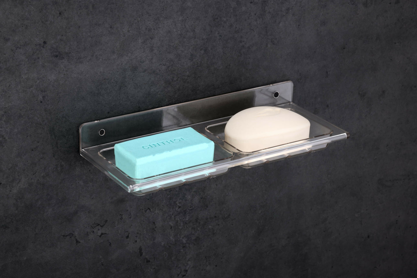 Double soap dish holder mounted on bathroom wall showing proper soap drainage