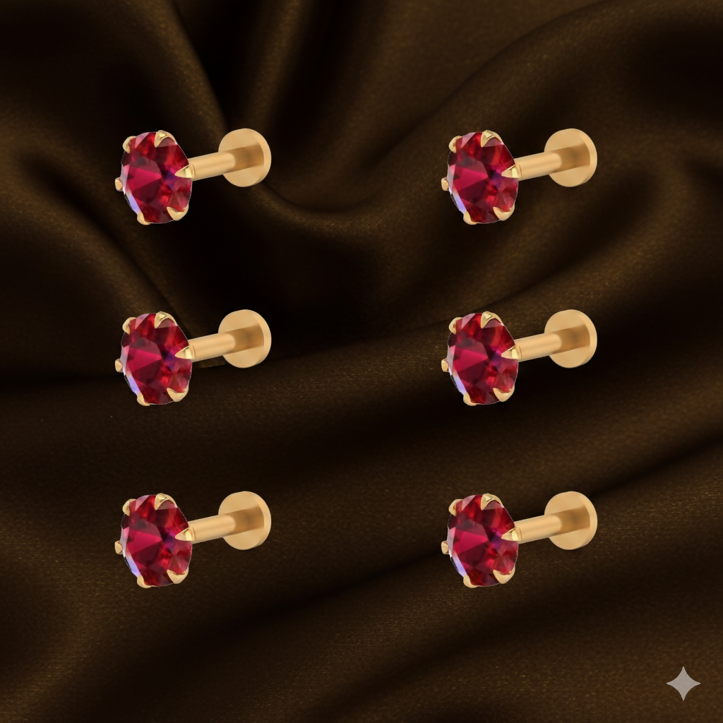 Close-up of red ruby flat back nosepin stud in an elegant gold-plated setting