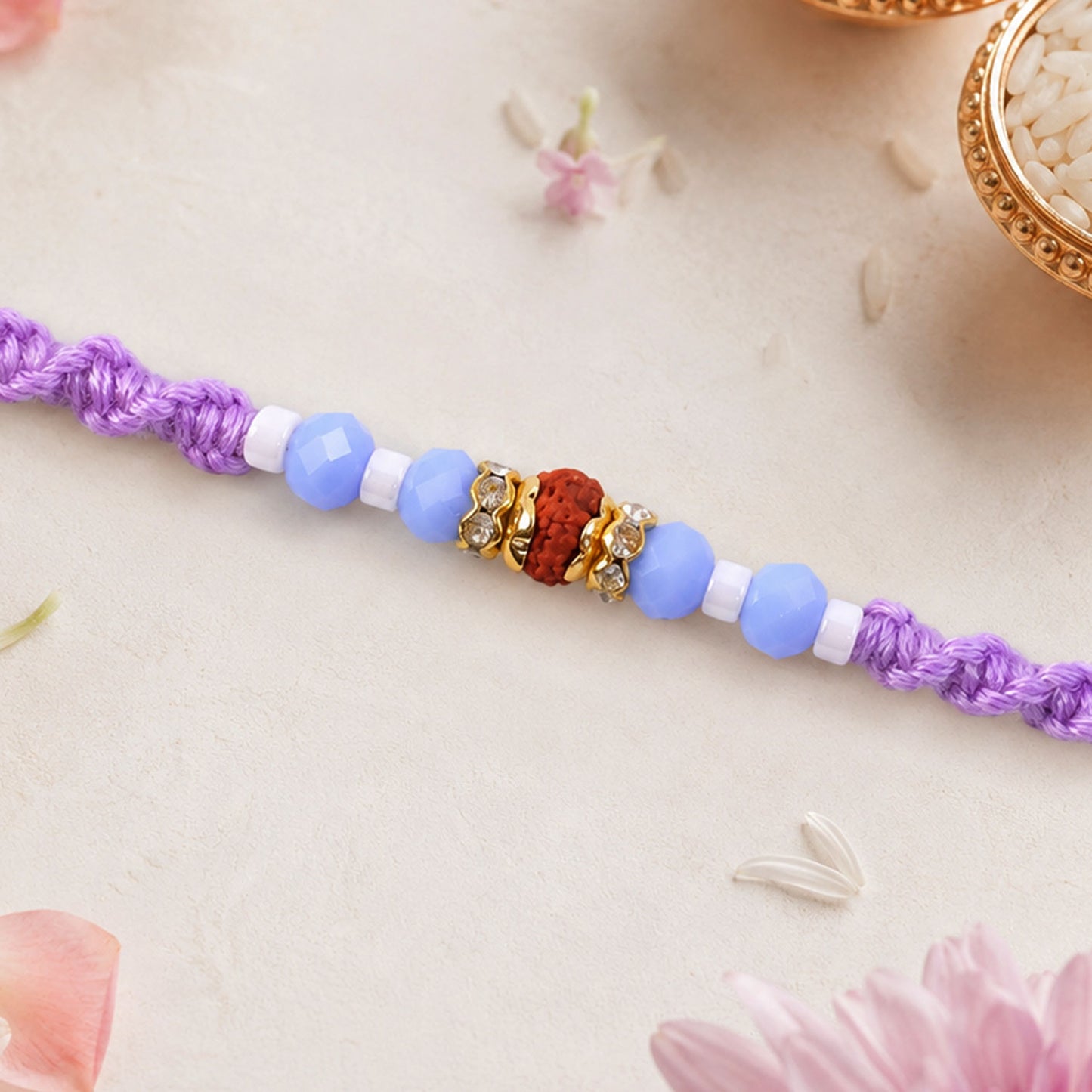 Sparkling Pearl Stone Rakhi with Colorful Thread and Premium Festive Beauty