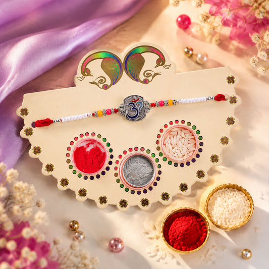 Om Symbol Rakhi with silver-tone centre and white beads in peacock gift packing.