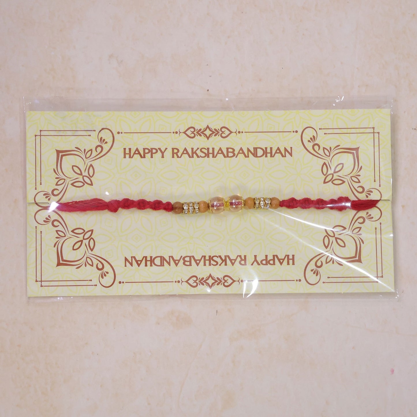 Red Braided Rakhi with Crystal and Natural Wooden Bead Accents
