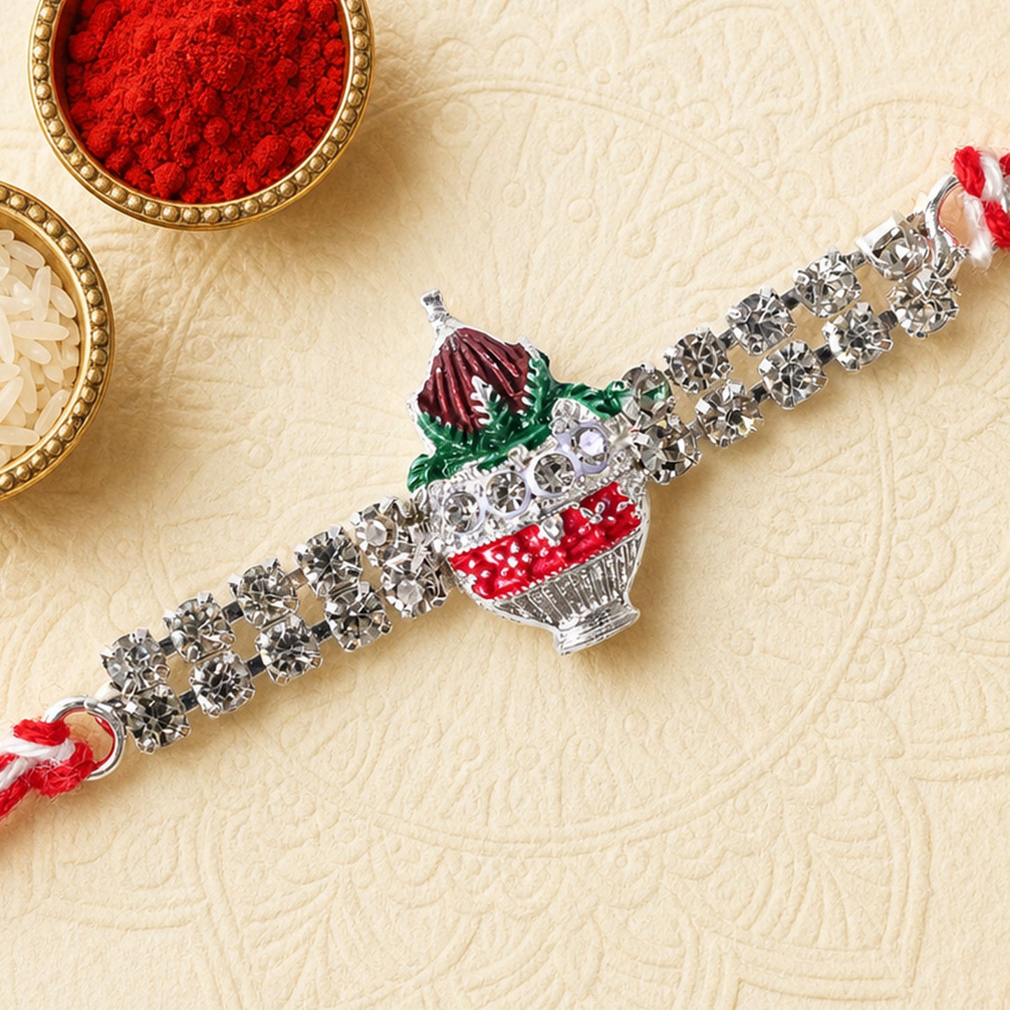 Festive Rakhi showcasing Kalash Charm, leaf detail and wrist style for Festive Use